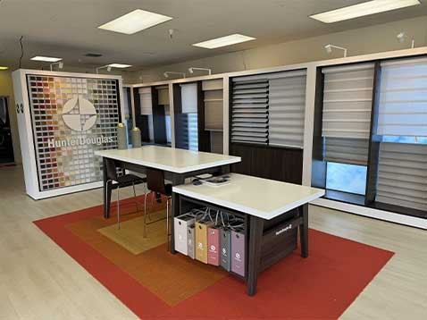 Store interior showcasing several different types of window coverings